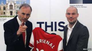 Arsenal club ambassador and previous player Freddie Ljungberg (right) and Uk ambassador to Japan Tim Hitchens pose with a jersey as Ljungberg encourages Arsenal's Asia tour within British Embassy in Tokyo on 7 June 2013