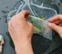 Rolling a brand new Spring Roll in rice-paper