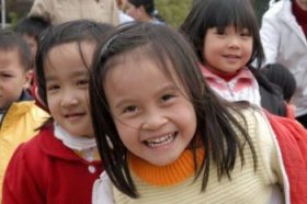 Schoolgirls smiling, Vietnam