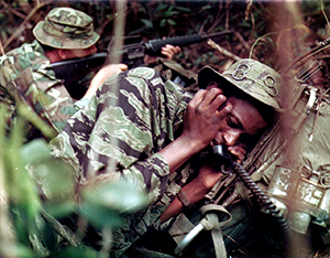 Sergeant Curtis Hester and Sergeant Billy Faulks during a firefight. Army photographs