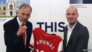 Arsenal club ambassador and previous player Freddie Ljungberg (right) and Uk ambassador to Japan Tim Hitchens pose with a jersey as Ljungberg encourages Arsenal's Asia tour within British Embassy in Tokyo on 7 June 2013