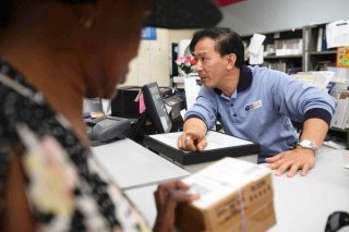 Postal staff member Raymond Tran is a large reason for the interest in the Little Saigon postoffice part in Westminster among those in the Vietnamese US community.